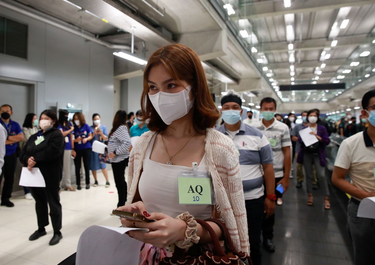 Volunteers line up during a drill as they prepare to reopen for tourists with coronavirus disease (COVID-19) prevention measures at Suvarnabhumi Airport, in Bangkok, Thailand October 27, 2021. REUTERS/Soe Zeya Tun