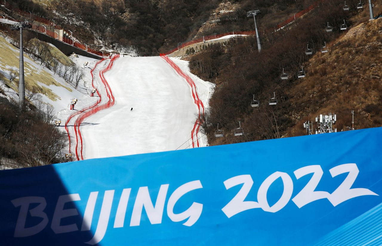 FILE PHOTO: A staff member skis down a slope during an organised media tour to the National Alpine Skiing Centre, a venue of the 2022 Winter Olympic Games, in Beijing