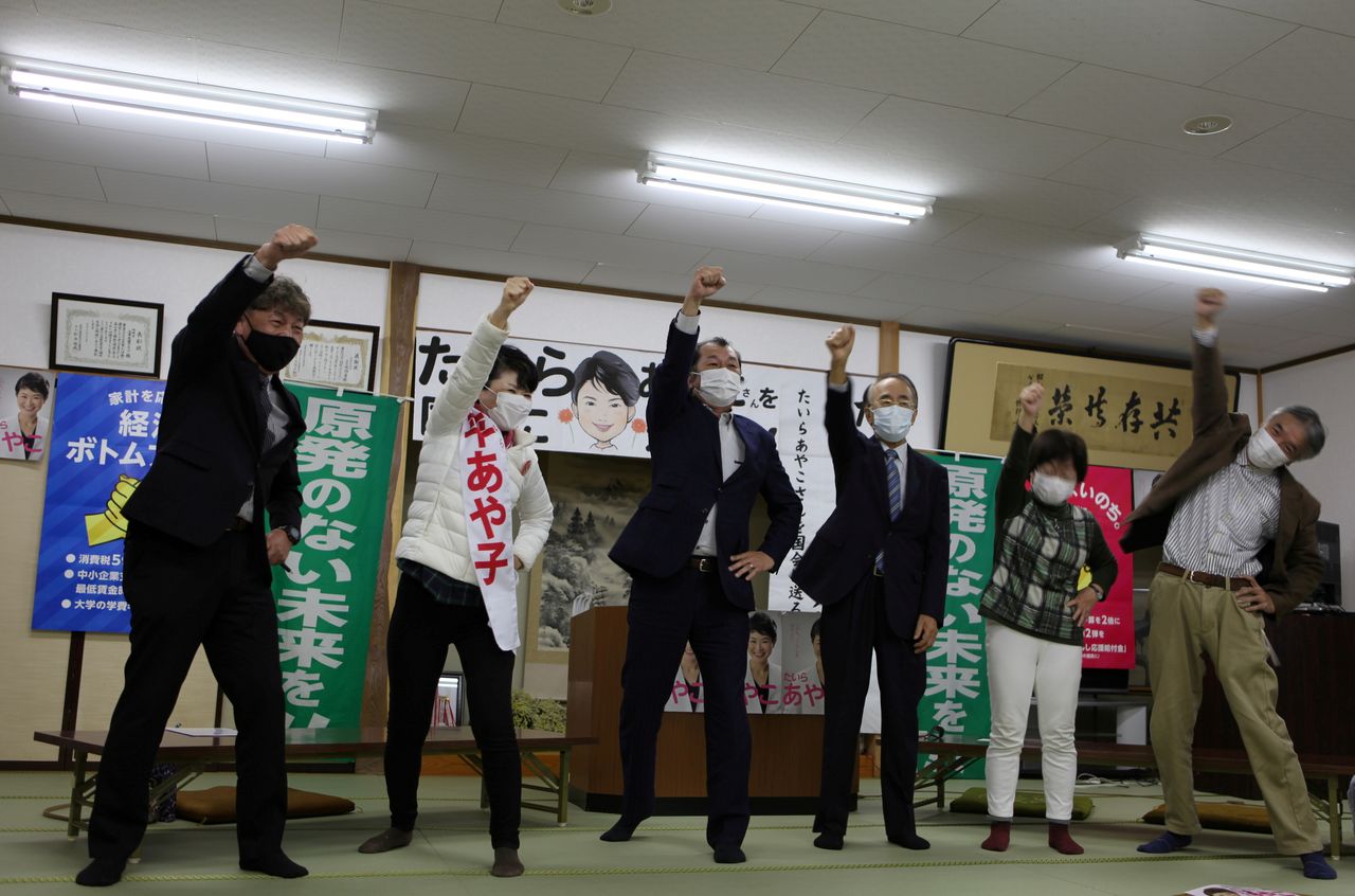 FILE PHOTO: Ayako Taira, a Japanese Communist Party candidate, pledges alongside supporters to do her best to win a seat in Kashiwazaki, Niigata Prefecture, Japan, October 22, 2021. REUTERS/Sakura Murakami
