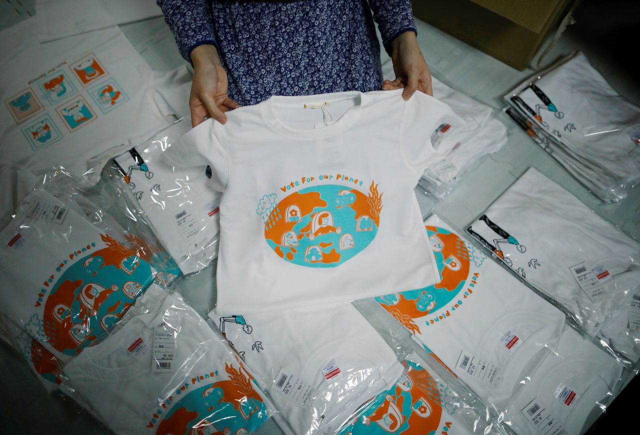 Youth activist and a member of "No Youth No Japan", Ayumi Adachi (20), carries out shipping work of T-shirts for a canpaign to urge young people to vote during elections, at her house in Tokyo, Japan October 20, 2021. REUTERS/Issei Kato