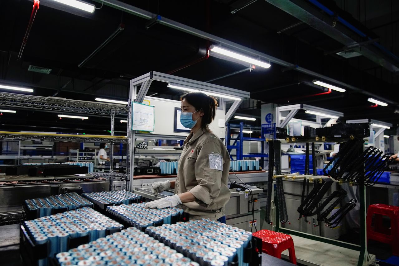 FILE PHOTO: An employee works on the production line of electric vehicle (EV) battery manufacturer Octillion in Hefei, Anhui province, China March 30, 2021. Picture taken March 30, 2021. REUTERS/Aly Song