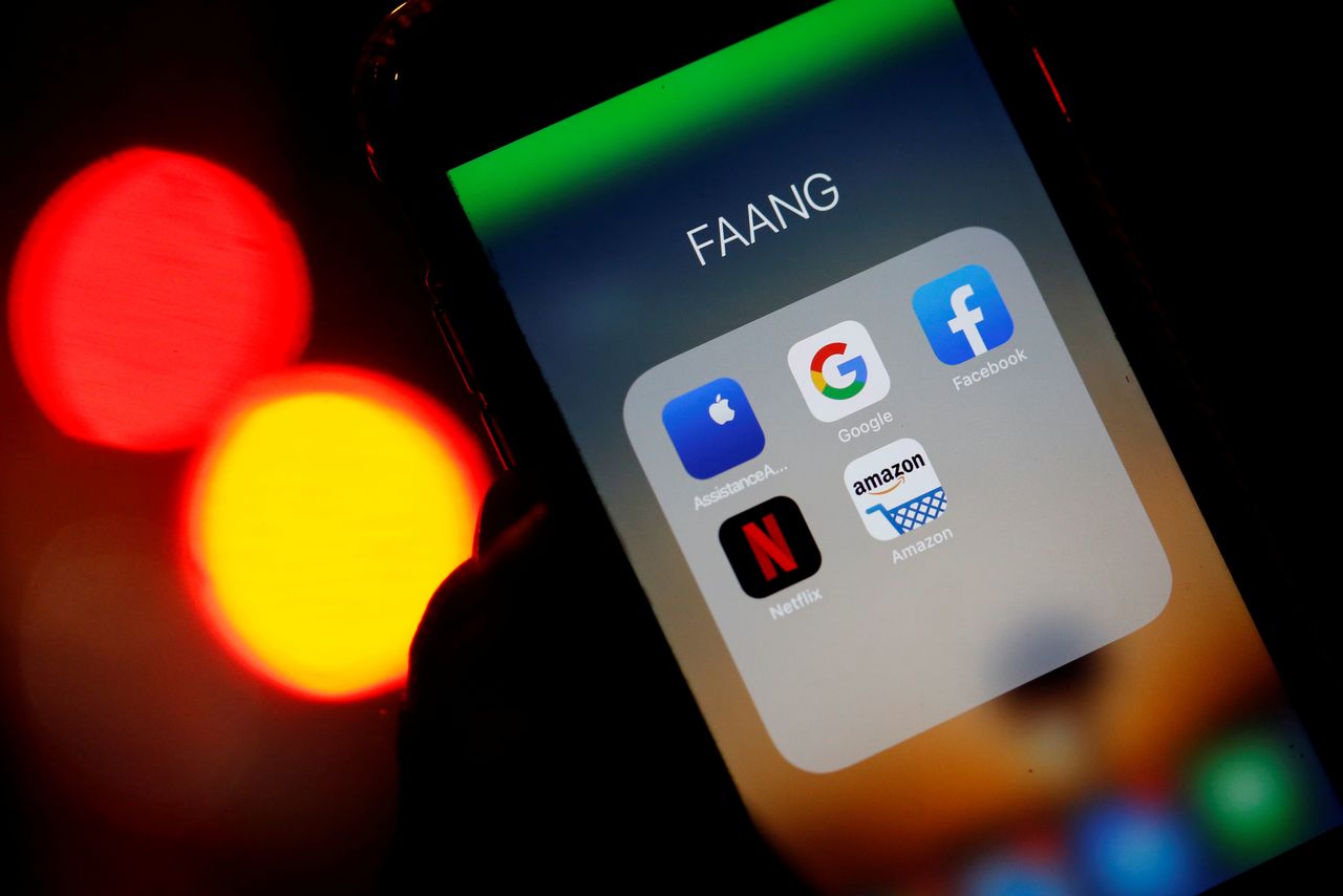 FILE PHOTO: The logos of mobile apps, Google, Amazon, Facebook, Apple and Netflix, are displayed on a screen in this illustration picture taken December 3, 2019. REUTERS/Regis Duvignau