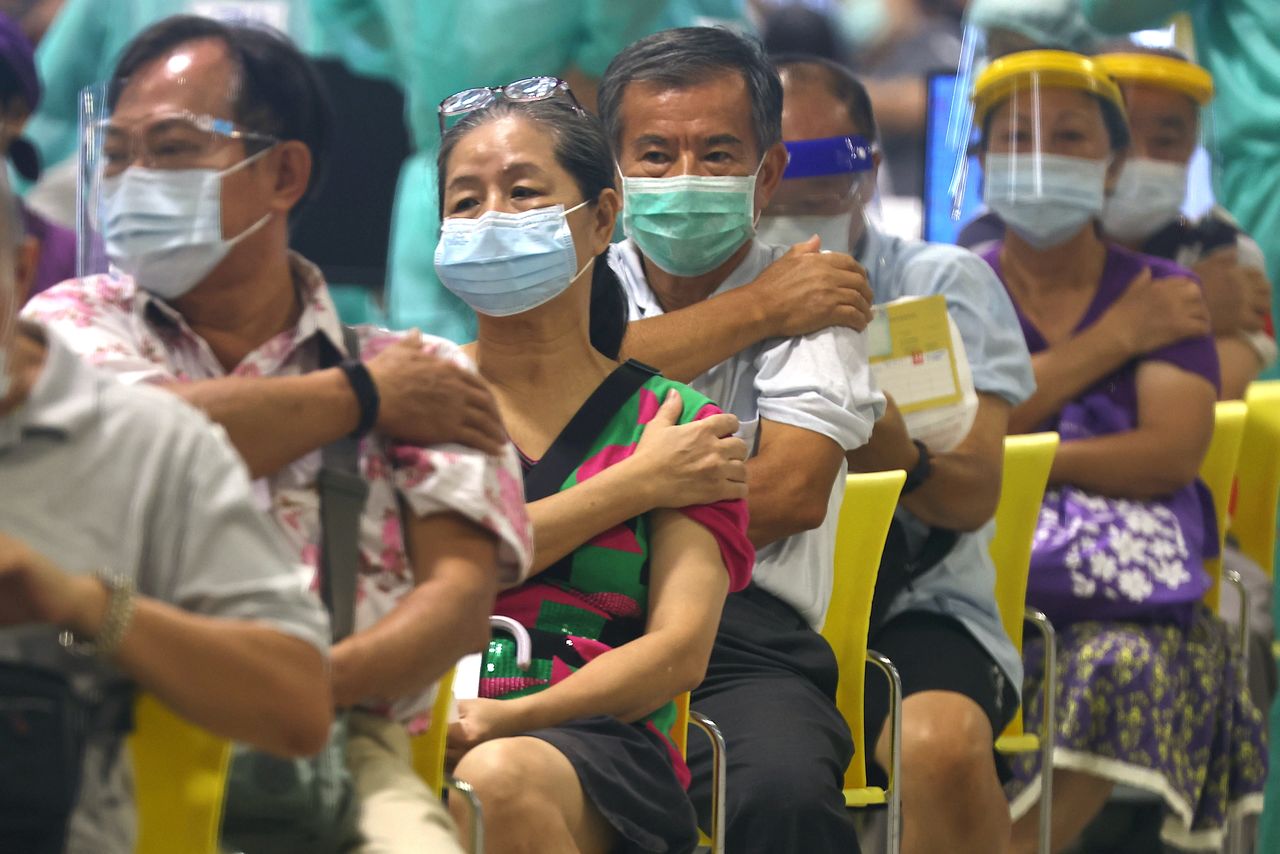 People rest after receiving a dose of the Moderna vaccine against the coronavirus disease (COVID-19) at an exhibition hall in Taipei City, Taiwan, July 14, 2021. REUTERS/Ann Wang