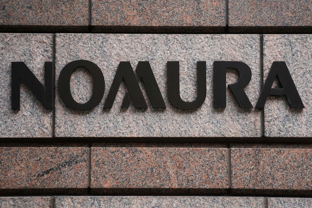 FILE PHOTO: A Nomura logo is pictured at their office in the Manhattan borough of New York City, New York, U.S. June 23, 2017.  REUTERS/Carlo Allegri