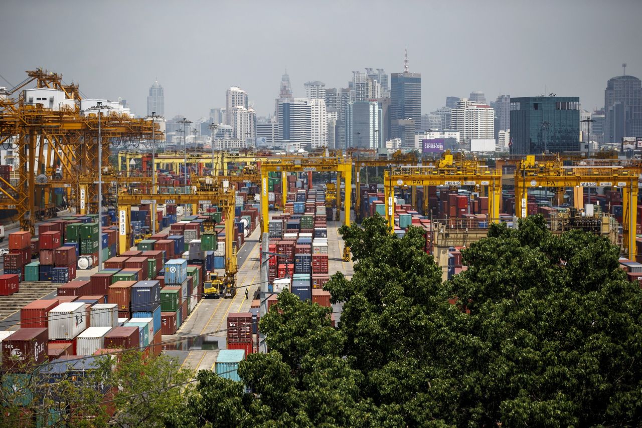 FILE PHOTO: Shipping containers stand at a port in Bangkok March 30, 2015. REUTERS/Athit Perawongmetha