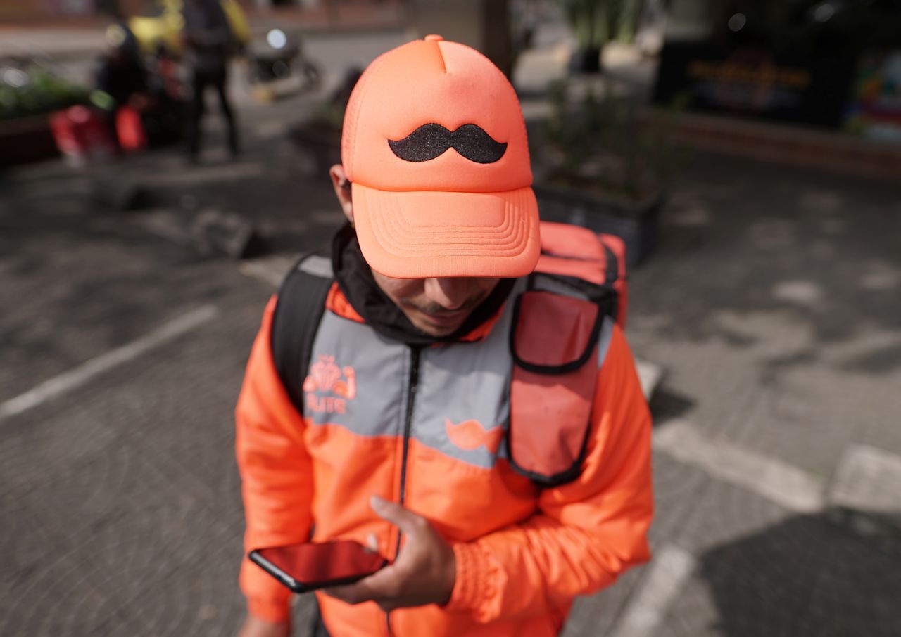 Yorkis Paz, delivery worker for mobile application Rappi, poses for a photograph, in Bogota, Colombia November 8, 2021. REUTERS/Nathalia Angarita