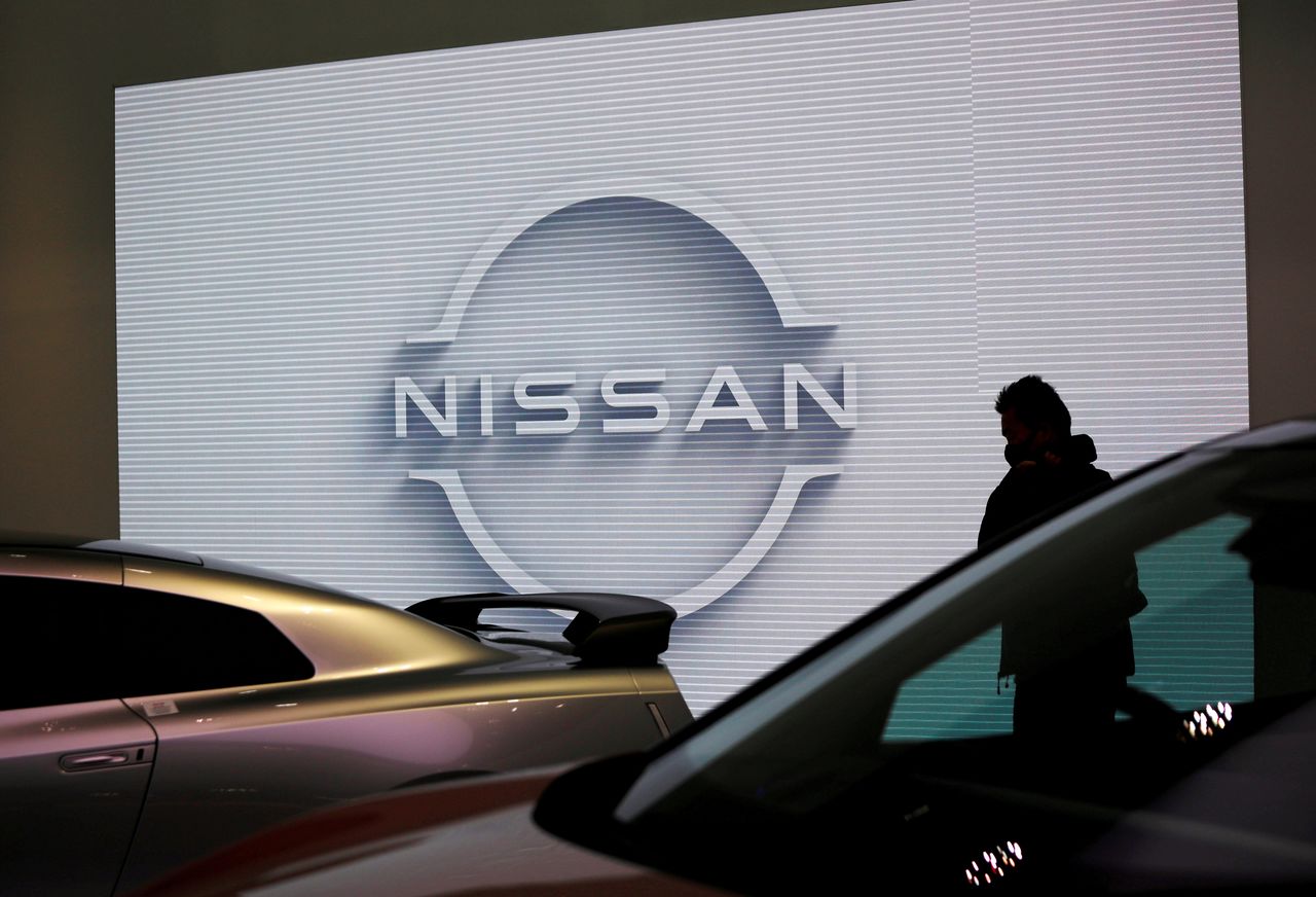 FILE PHOTO: A visitor is seen at a Nissan Motor Corp. showroom in Tokyo, Japan November 11, 2020.  REUTERS/Issei Kato
