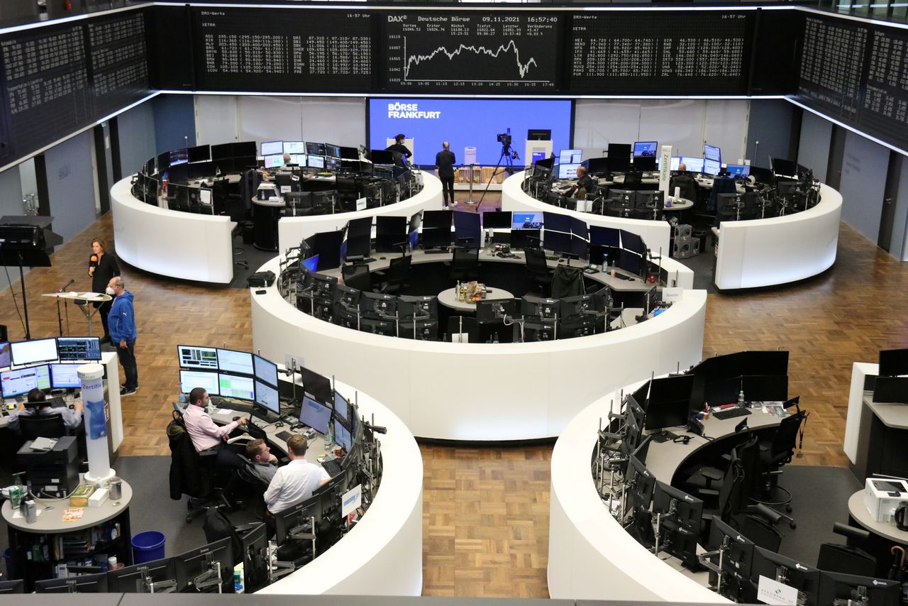 FILE PHOTO: The German share price index DAX graph is pictured at the stock exchange in Frankfurt, Germany, November 9, 2021. REUTERS/Staff