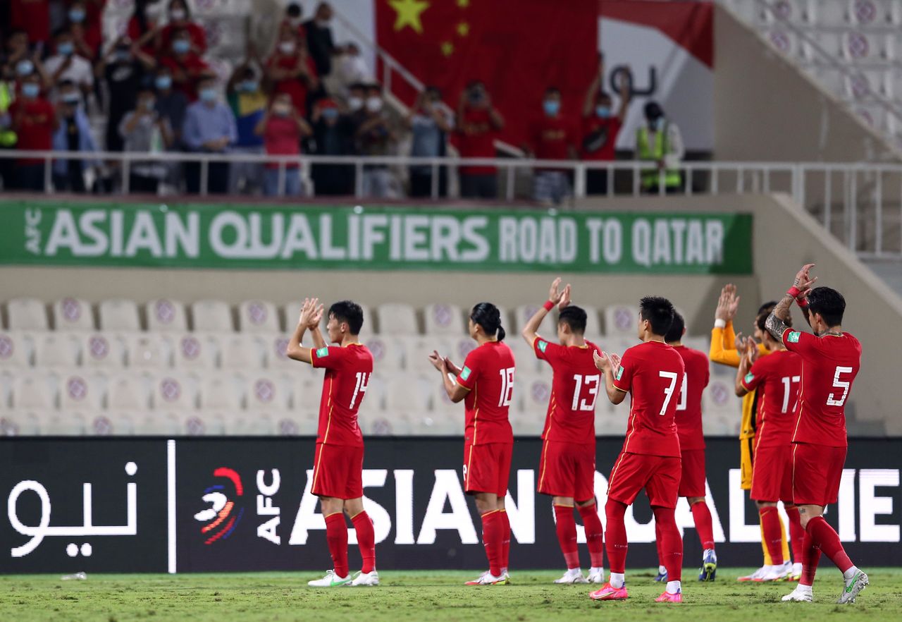 Soccer Football - World Cup - Asian Qualifiers - Third Round - Group B - China v Australia - Sharjah Stadium, Sharjah, United Arab Emirates - November 16, 2021 China players applaud fans after the match REUTERS/Satish Kumar