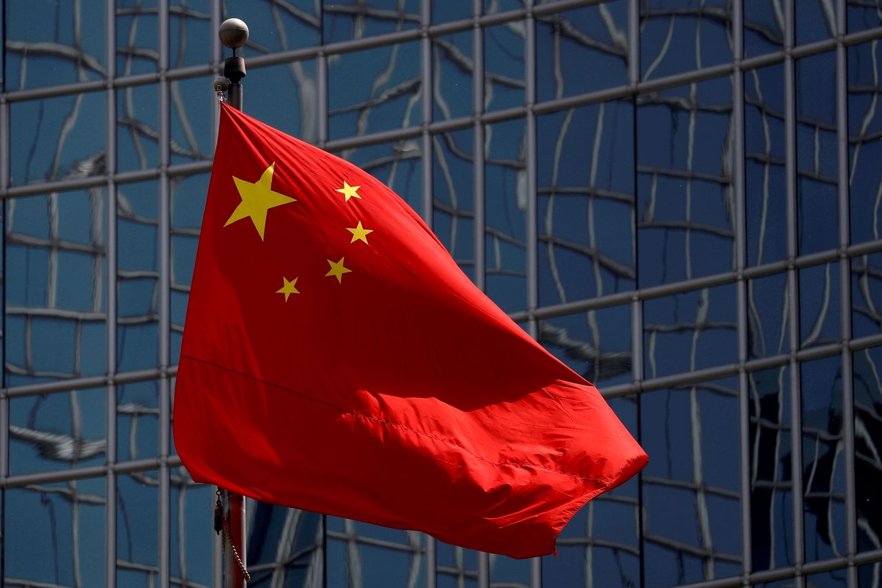 FILE PHOTO: The Chinese national flag is seen in Beijing, China April 29, 2020. REUTERS/Thomas Peter/File Photo