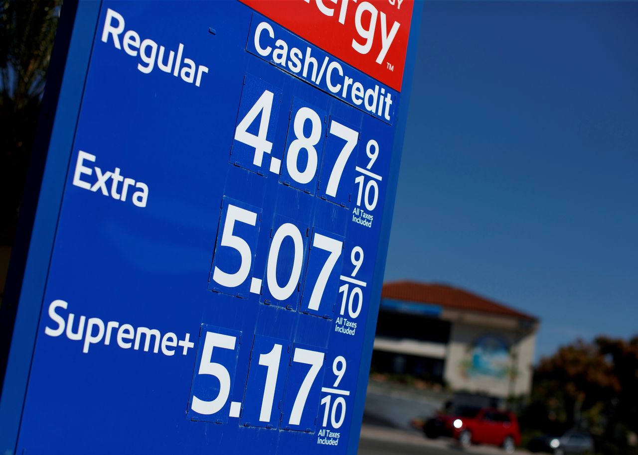 FILE PHOTO: Gas prices grow along with inflation as this sign at a gas station shows in San Diego, California, U.S. November, 9, 2021.  REUTERS/Mike Blake/File Photo/File Photo