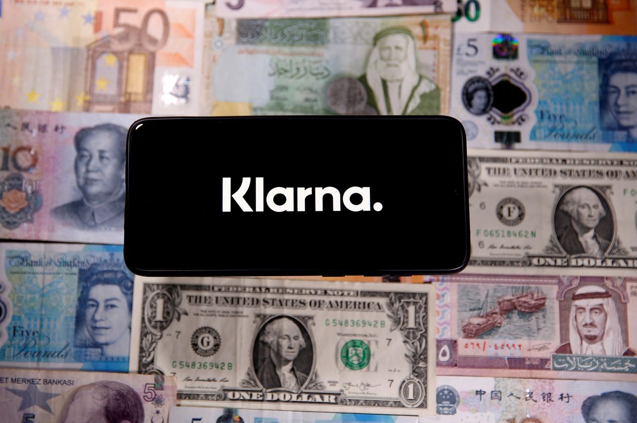 FILE PHOTO: A smartphone displays a Klarna logo on top of banknotes is in this illustration taken January 6, 2020. REUTERS/Dado Ruvic