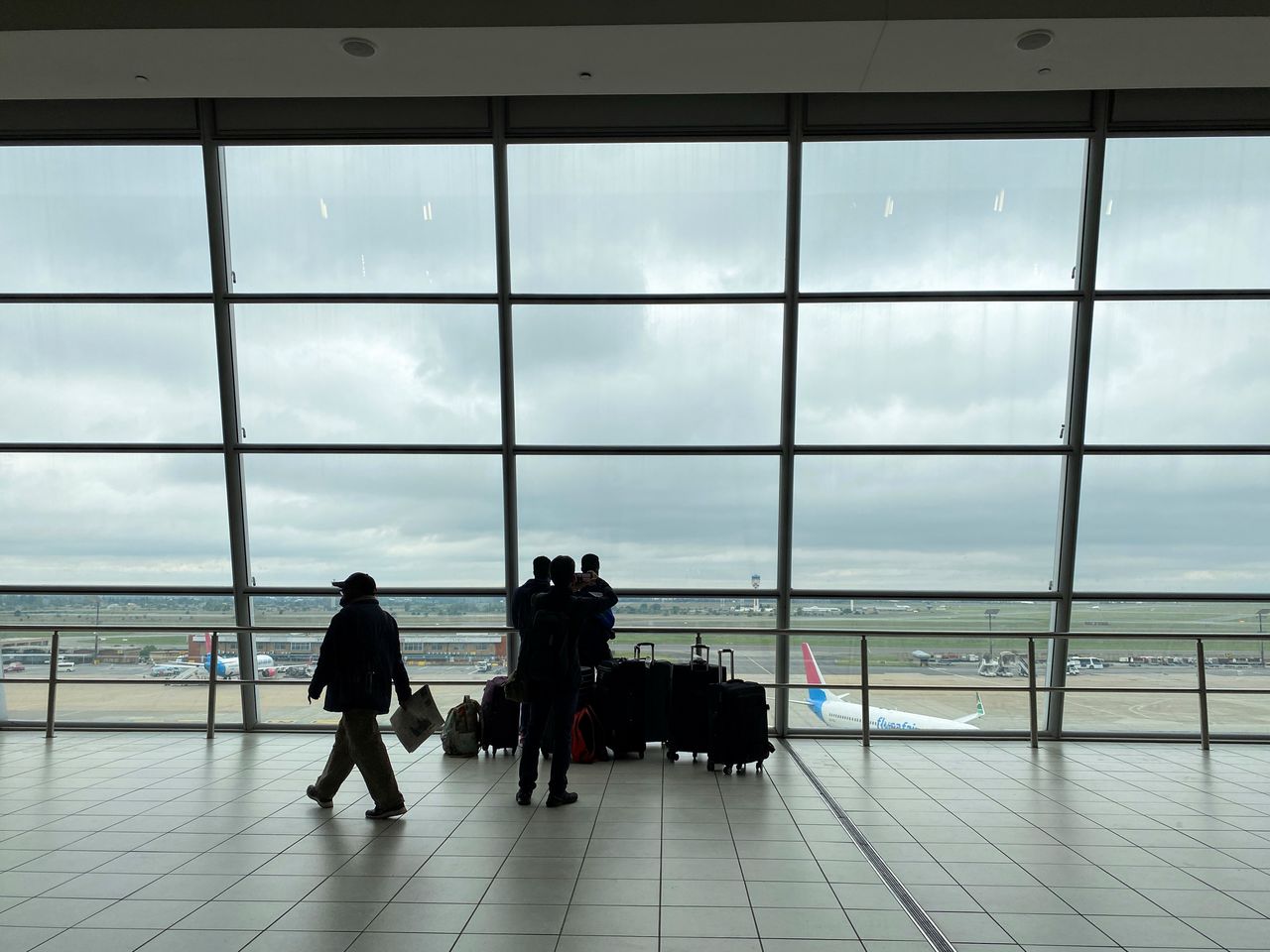Passengers wait to board flights, amidst the spread of the new SARS-CoV-2 variant, at O.R. Tambo International Airport in Johannesburg, South Africa, November 27, 2021. REUTERS/ Sumaya Hisham