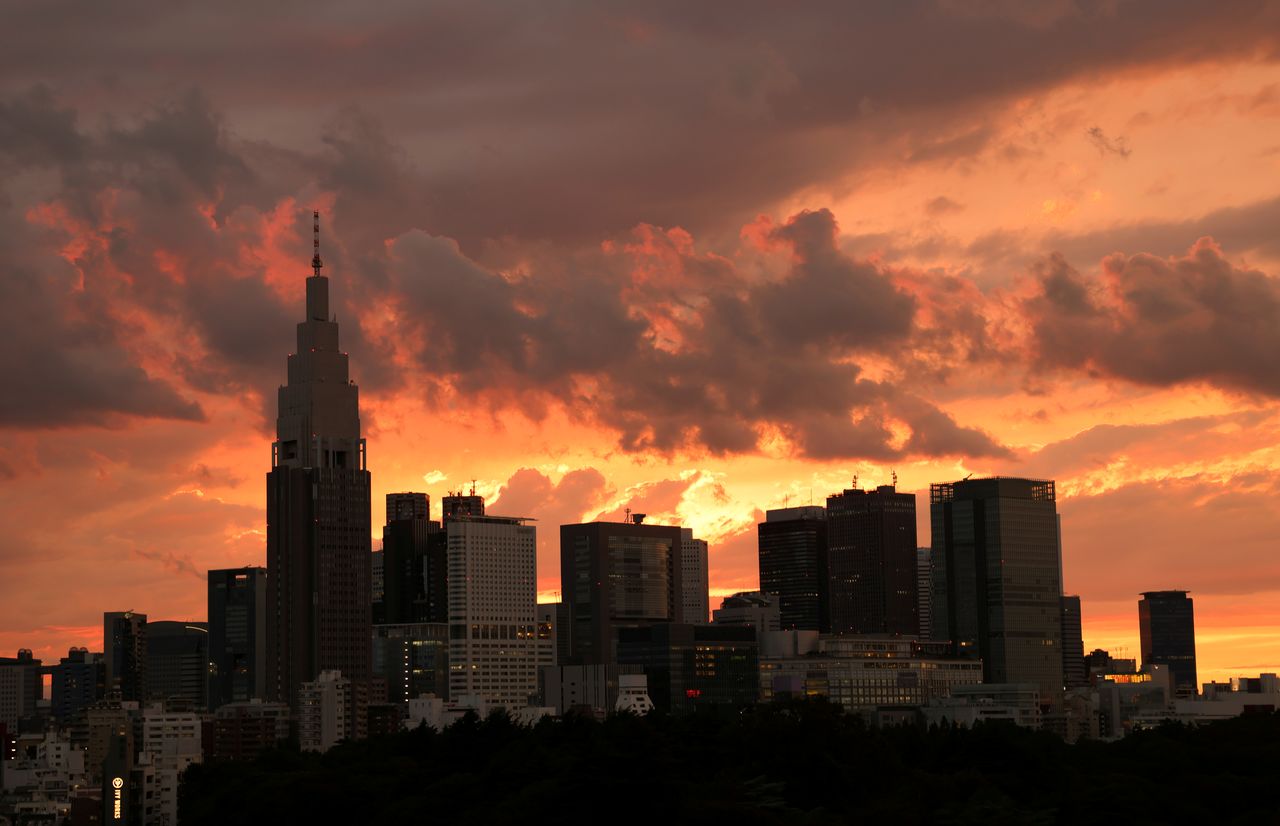 FILE PHOTO: A view of the skyline and buildings at Shinjuku district during sunset in Tokyo, Japan June 20, 2021. REUTERS/Pawel Kopczynski