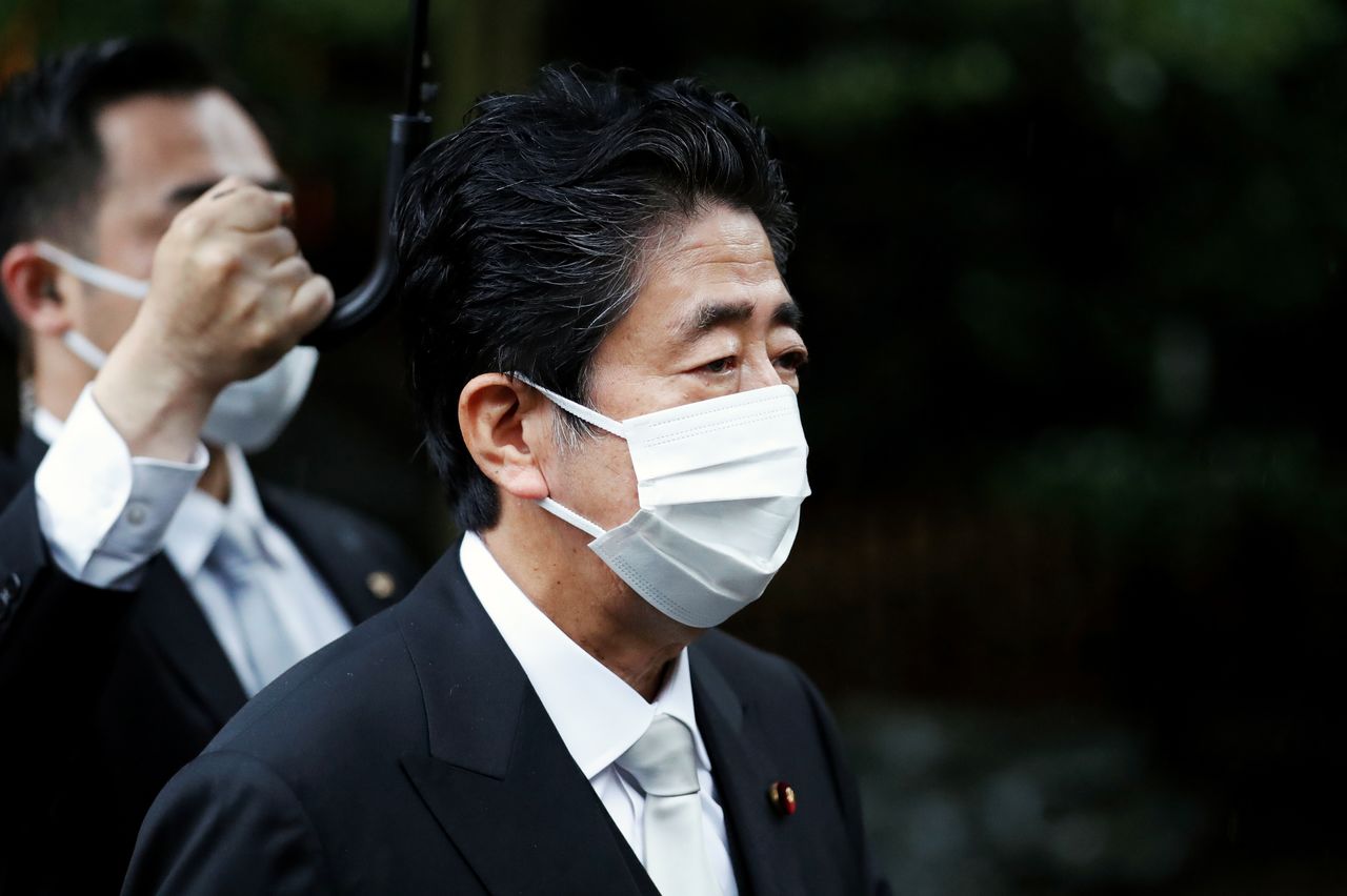 FILE PHOTO: Former Japanese Prime Minister Shinzo Abe visits Yasukuni Shrine in Tokyo, Japan August 15, 2021. REUTERS/Issei Kato