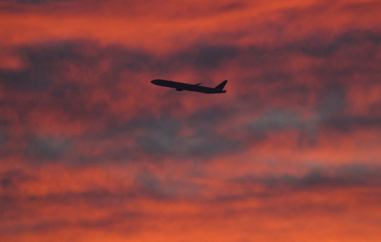 FILE PHOTO: A plane is seen shortly after take-off at sunset, from Heathrow Airport, London, Britain, December 11, 2020. REUTERS/Toby Melville/File Photo