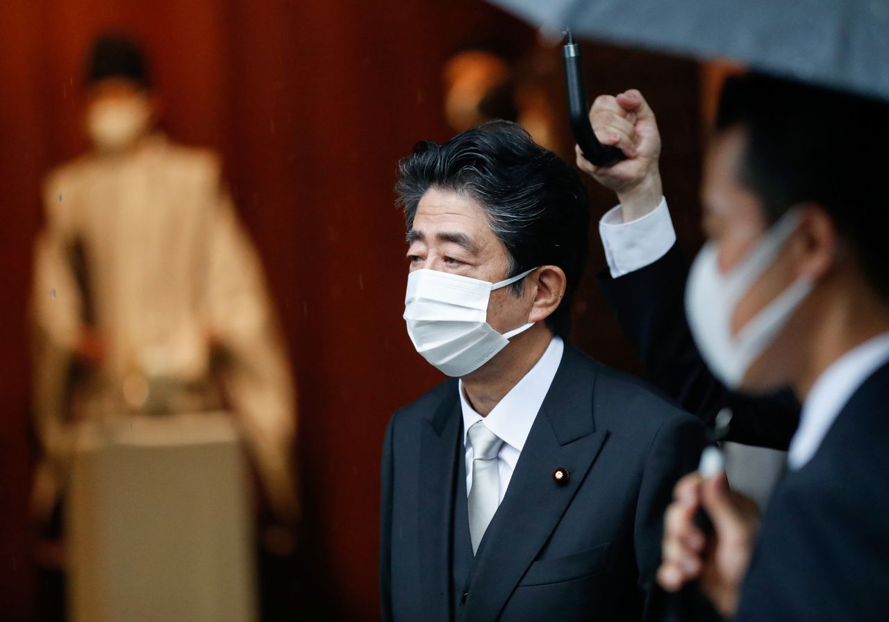 FILE PHOTO: Former Japanese prime minister Shinzo Abe visits Yasukuni Shrine on the 76th anniversary of Japan