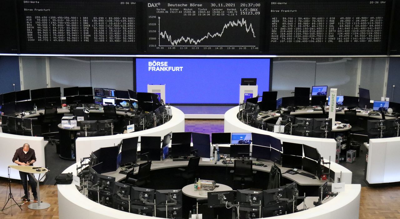 FILE PHOTO: The German share price index DAX graph is pictured at the stock exchange in Frankfurt, Germany, November 30, 2021. REUTERS/Staff
