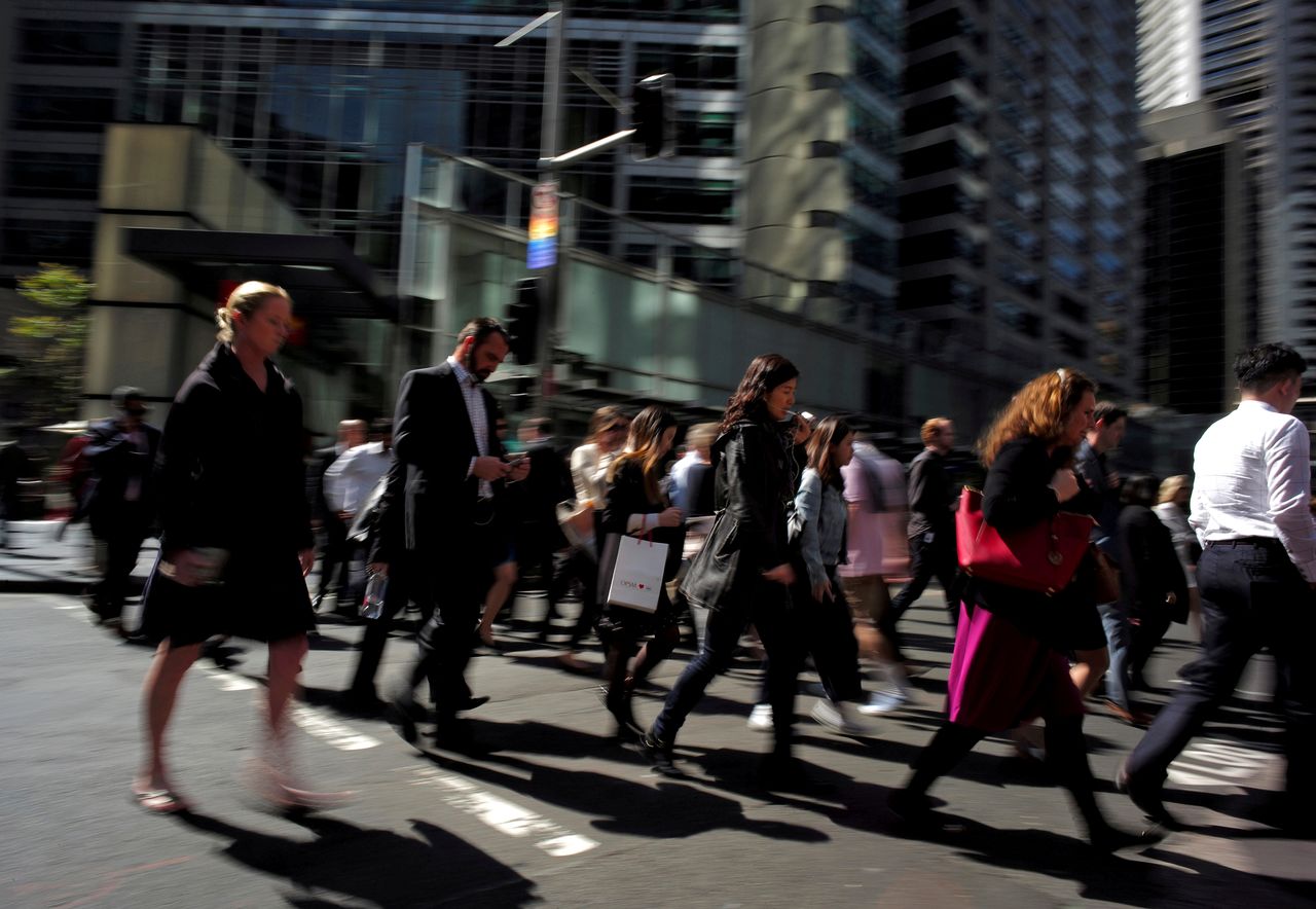 FILE PHOTO: Office workers and shoppers walk through Sydney
