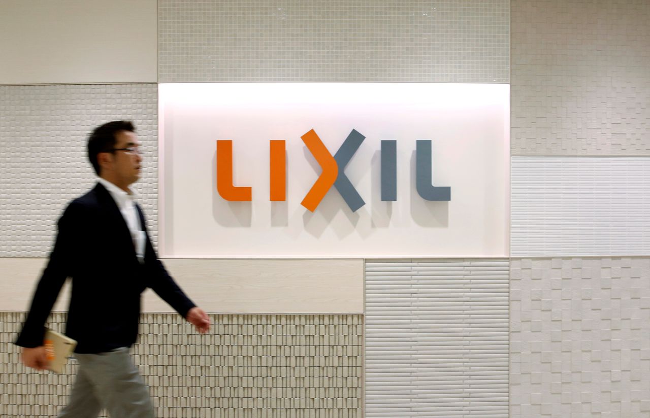 FILE PHOTO: The logo of Lixil Group Corp. is displayed at the company headquarters in Tokyo September 26, 2013. REUTERS/Issei Kato/File Photo