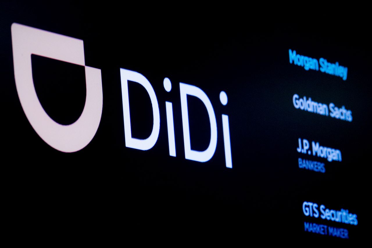 FILE PHOTO: The logo for Chinese ride-hailing company Didi Global Inc is pictured at the New York Stock Exchange (NYSE) floor in New York City, U.S., June 30, 2021.  REUTERS/Brendan McDermid/File Photo
