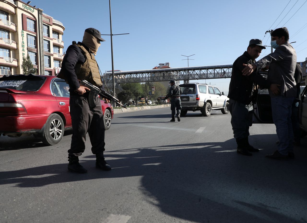 FILE PHOTO: Afghan policemen keep watch at a checkpoint in Kabul, Afghanistan April 19, 2021 REUTERS/Omar Sobhani