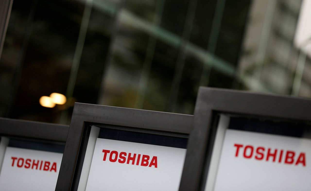 FILE PHOTO: Logos  of Toshiba Corp are pictured at a venue of the company