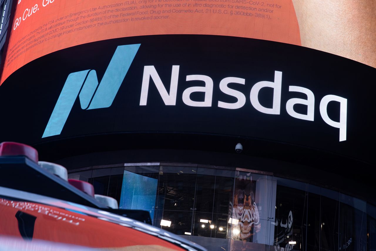 FILE PHOTO: The Nasdaq logo is displayed at the Nasdaq Market site in Times Square in New York City, U.S., December 3, 2021. REUTERS/Jeenah Moon