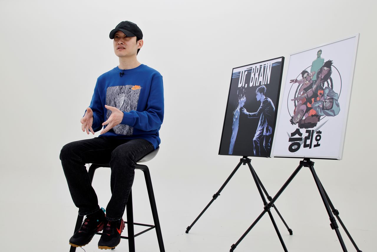 FILE PHOTO: Hongjacga, cartoonist of Kakao Webtoon Dr. Brain, speaks during an interview with Reuters at a company studio in Seongnam, South Korea, December 1, 2021. REUTERS/ Heo Ran NO RESALES. NO ARCHIVES