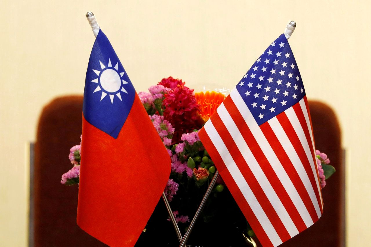 FILE PHOTO: Flags of Taiwan and U.S. are placed for a meeting in Taipei, Taiwan March 27, 2018. REUTERS/Tyrone Siu/File Photo