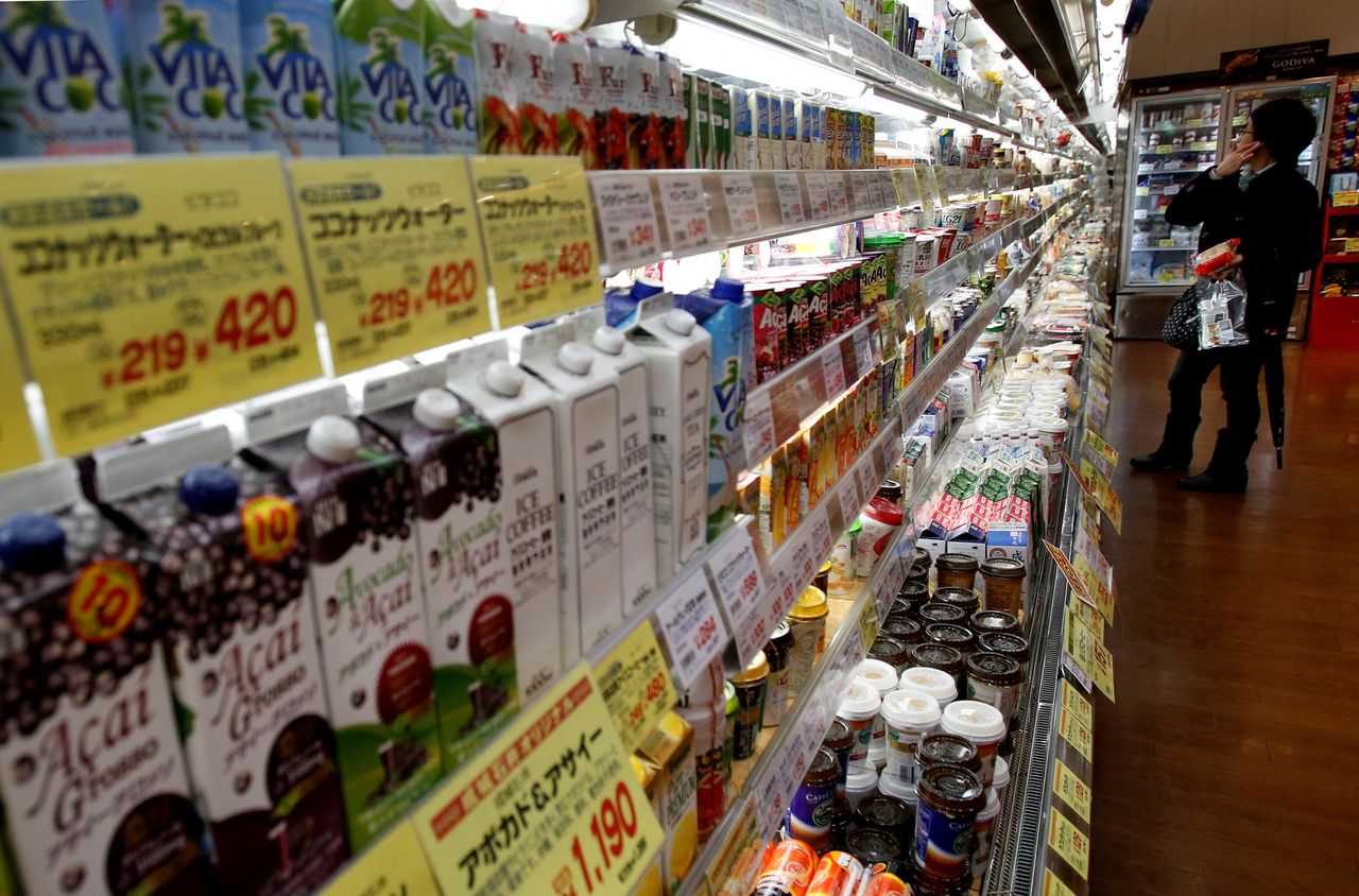 FILE PHOTO: A shopper looks at items at a supermarket in Tokyo February 26, 2015. REUTERS/Yuya Shino/File Photo