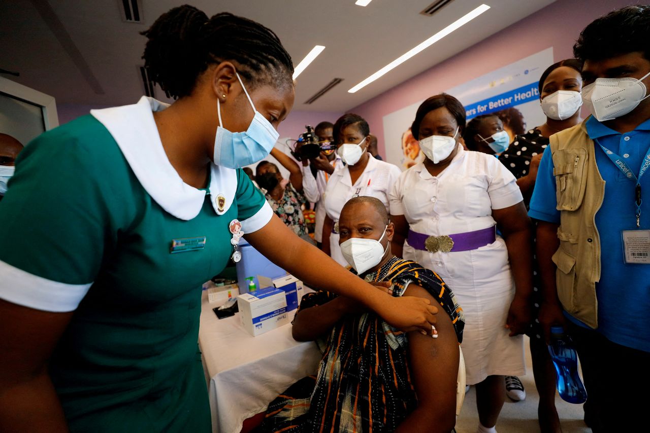 FILE PHOTO: Director General of the Ghana Health Service Dr. Patrick Kuma-Aboagye receives the coronavirus disease (COVID-19) vaccine during the vaccination campaign at the Ridge Hospital in Accra, Ghana March 2, 2021. REUTERS/Francis Kokoroko
