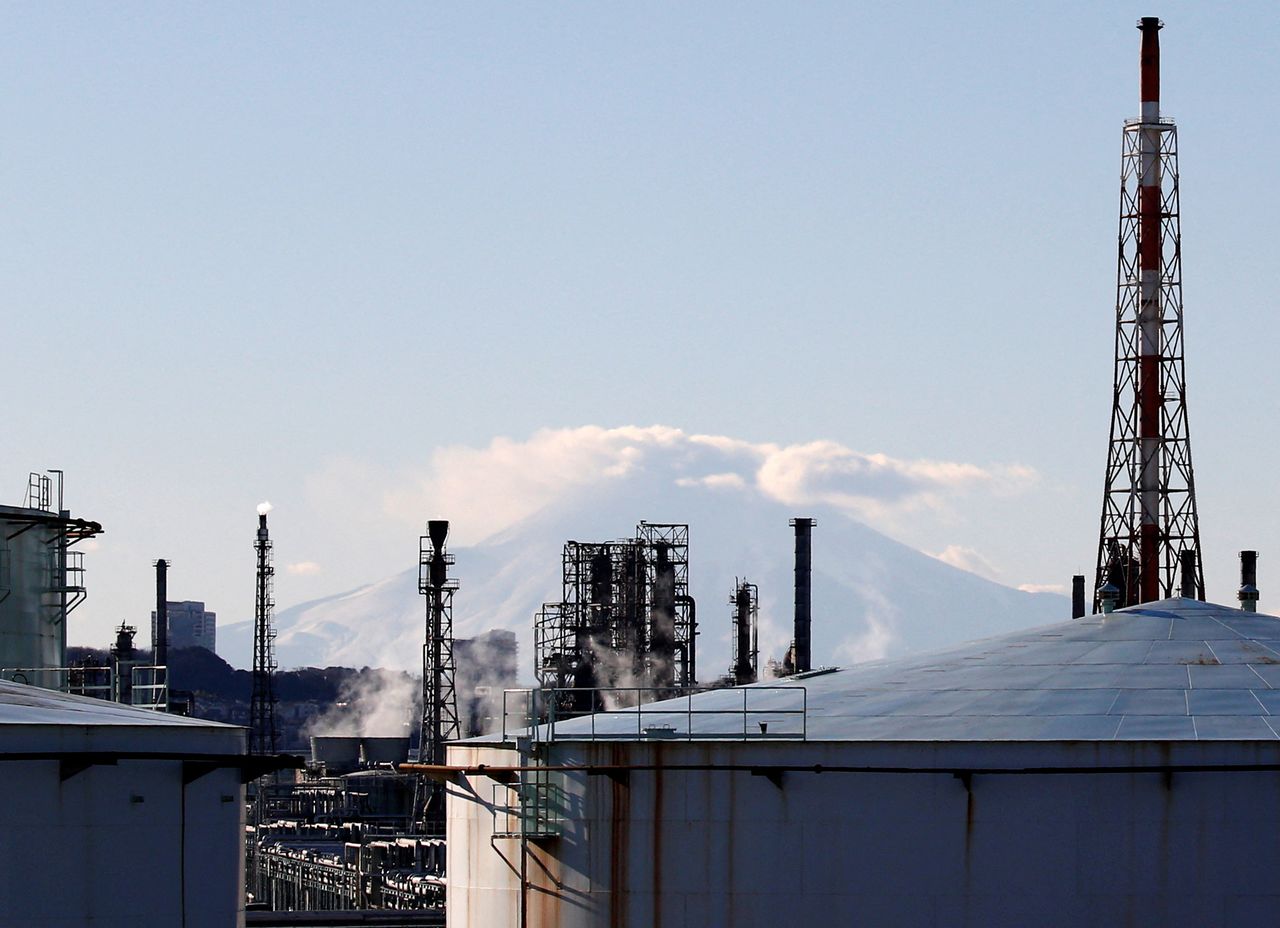 FILE PHOTO: A factory area is seen in front of Mount Fuji in Yokohama, Japan, January 16, 2017. Picture taken on January 16, 2017.  REUTERS/Kim Kyung-Hoon