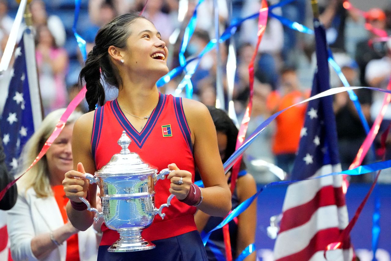 FILE PHOTO: Sep 11, 2021; Flushing, NY, USA; Emma Raducanu of Great Britain celebrates with the championship trophy after her match against Leylah Fernandez of Canada (not pictured) in the women