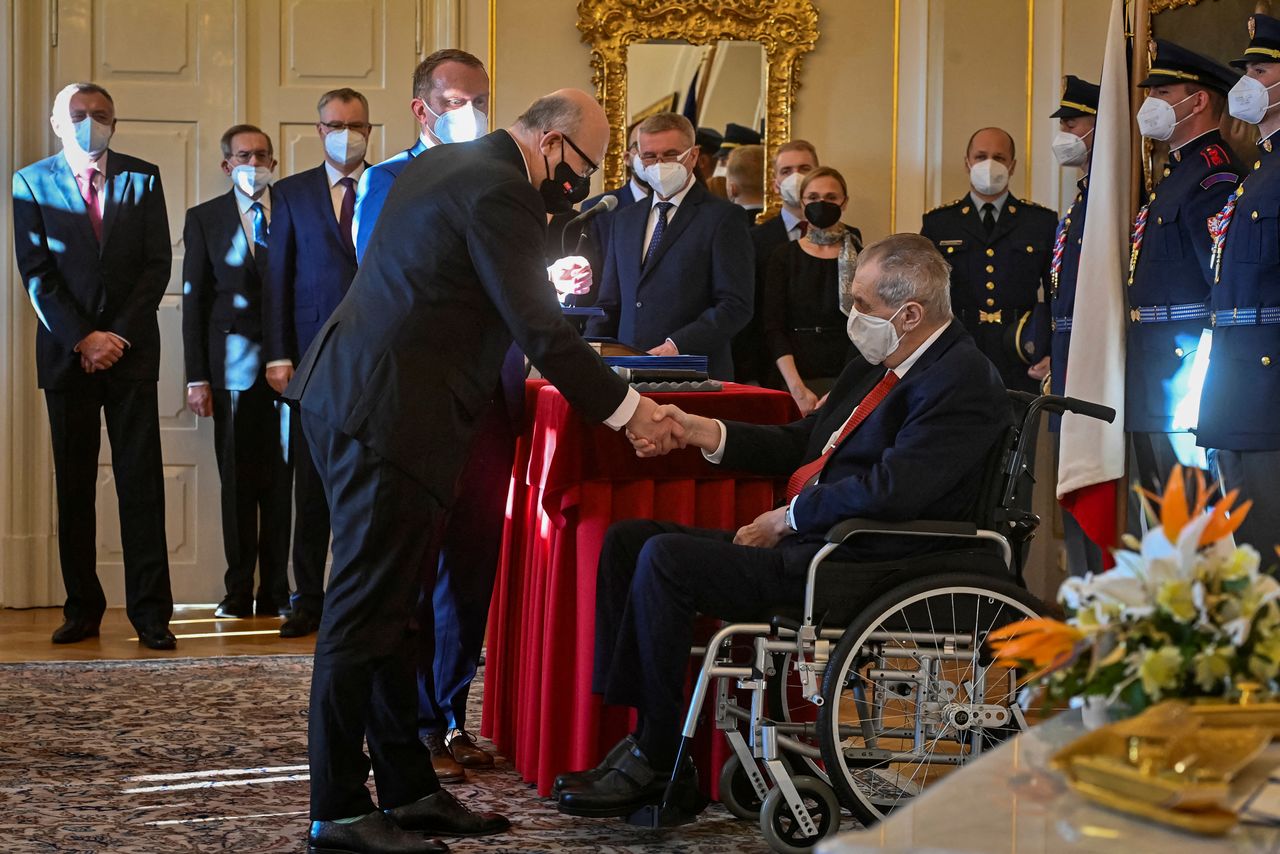 Czech President Milos Zeman handshakes with new Health Minister Vlastimil Valek as he appoints ministers of new?Czech?cabinet of Petr Fiala at the Lany Chateau, Czech Republic December 17, 2021. Vit Simanek/Pool via REUTERS