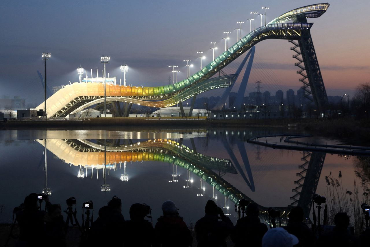 Big Air Shougang, a competition venue for freestyle skiing and snowboard during the Beijing 2022 Winter Olympics, is lit at dusk during an organised media tour, in Beijing, China December 15, 2021. REUTERS/Tingshu Wang