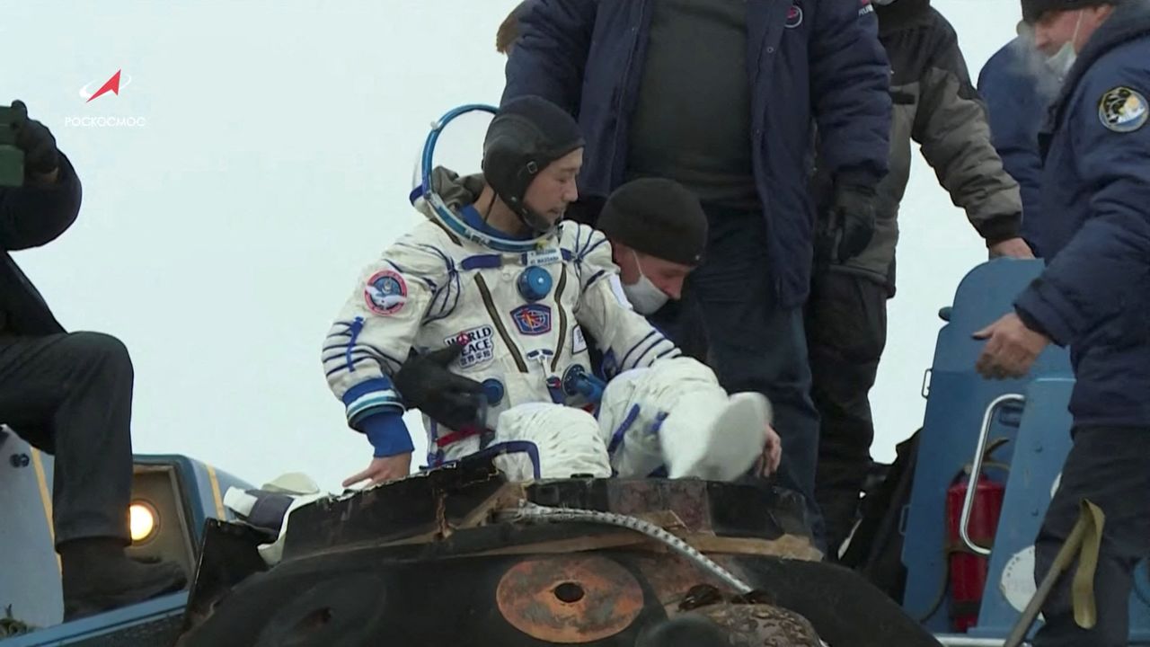 Ground personnel assist Japanese entrepreneur Yusaku Maezawa shortly after landing of the Soyuz MS-20 space capsule in a remote area outside Zhezkazgan, Kazakhstan December 20, 2021, in this still image taken from video. Roscosmos/Handout via REUTERS ATTENTION EDITORS - THIS IMAGE HAS BEEN SUPPLIED BY A THIRD PARTY. MANDATORY CREDIT.