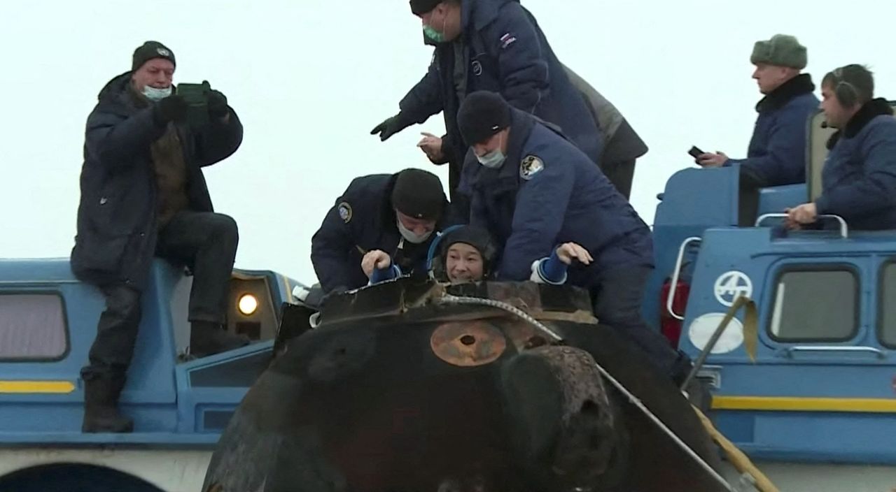 Ground personnel assist Japanese entrepreneur Yusaku Maezawa shortly after landing of the Soyuz MS-20 space capsule in a remote area outside Zhezkazgan, Kazakhstan December 20, 2021, in this still image taken from video. Roscosmos/Handout via REUTERS ATTENTION EDITORS - THIS IMAGE HAS BEEN SUPPLIED BY A THIRD PARTY. MANDATORY CREDIT. THIS PICTURE WAS PROCESSED BY REUTERS TO ENHANCE QUALITY. AN UNPROCESSED VERSION HAS BEEN PROVIDED SEPARATELY
