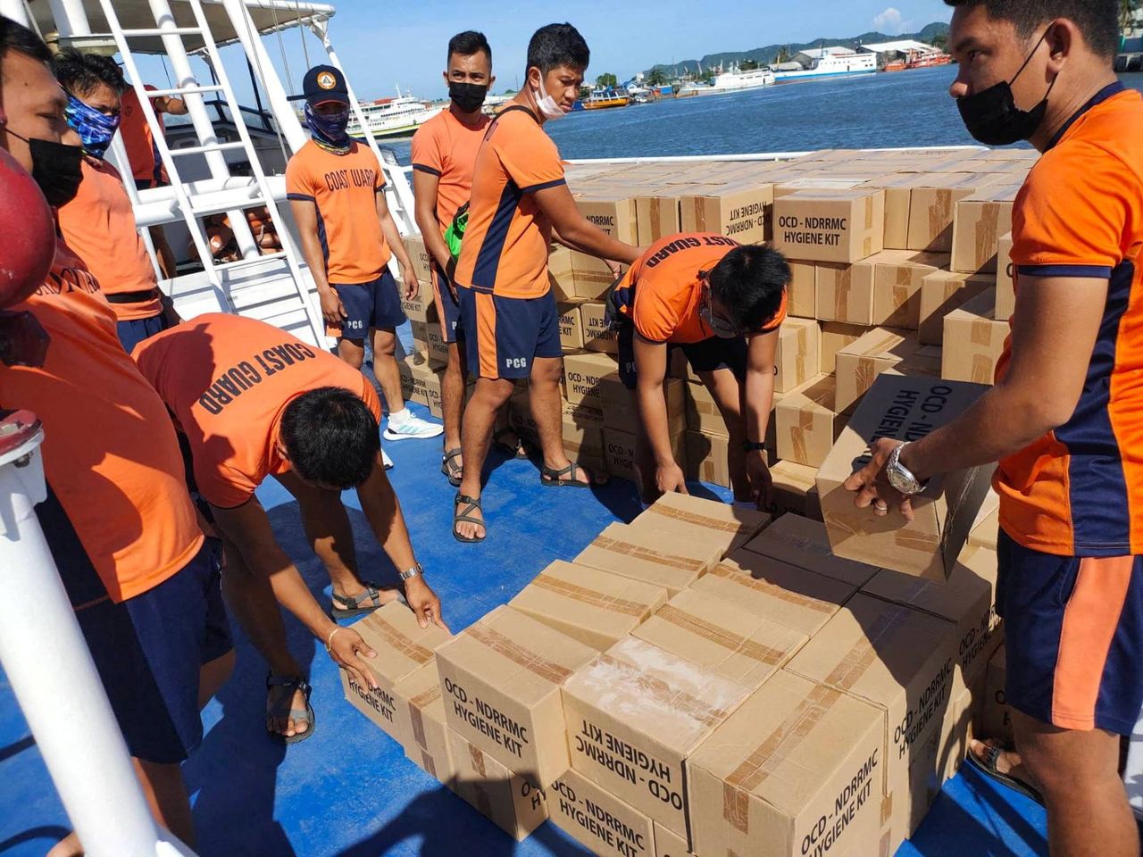 Philippine Coast Guard personnel unload packs of relief goods for victims of Typhoon Rai, in Bacolod City, Negros Occidental, Philippines, December 21, 2021. Philippine Coast Guard/Handout via REUTERS.