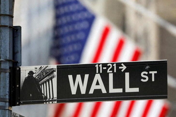 FILE PHOTO: A street sign for Wall Street is seen outside the New York Stock Exchange (NYSE) in New York City, New York, U.S., July 19, 2021. REUTERS/Andrew Kelly/File Photo/File Photo