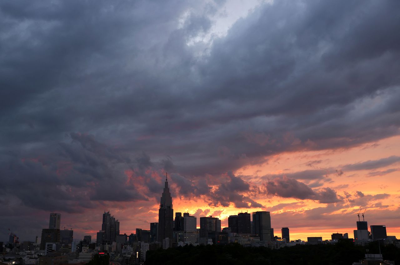 FILE PHOTO: A view of the skyline and buildings at Shinjuku district during sunset in Tokyo, Japan June 20, 2021. REUTERS/Pawel Kopczynski