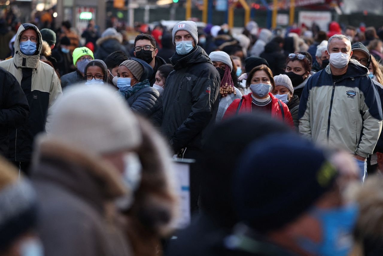 People queue for a COVID-19 test in Times Square as the Omicron coronavirus variant continues to spread in Manhattan, New York City, U.S., December 26, 2021. REUTERS/Andrew Kelly