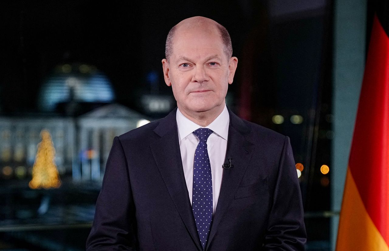 German Chancellor Olaf Scholz poses for photographs during the television recording of his annual New Year