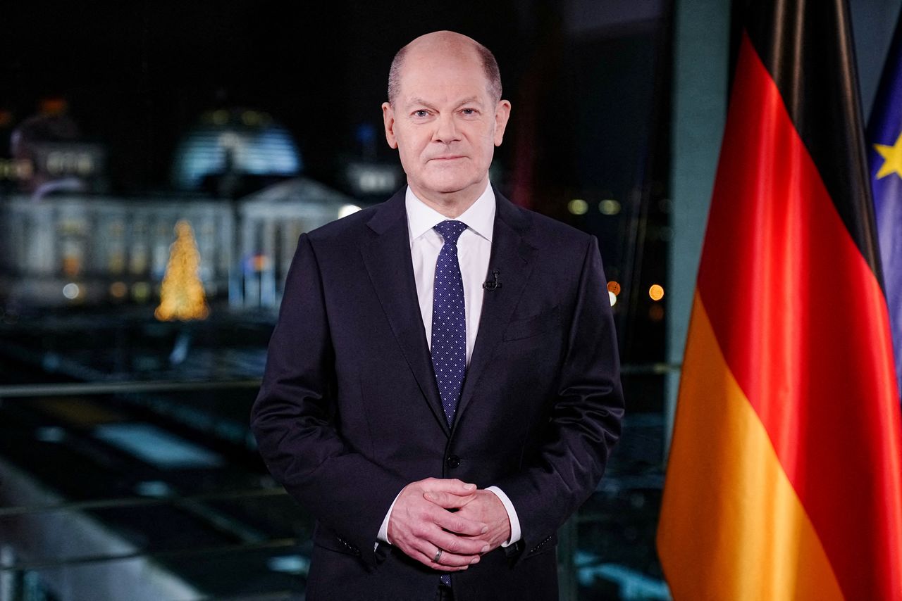 German Chancellor Olaf Scholz poses for photographs during the television recording of his annual New Year