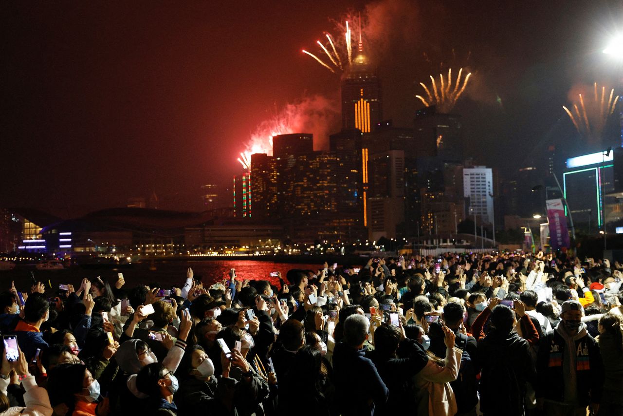 Fireworks explode over skyline building to celebrate New Year in Hong Kong, China, January 1, 2022. REUTERS/Tyrone Siu