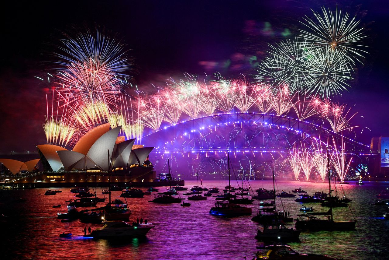 Fireworks explode over Sydney Harbour during New Year