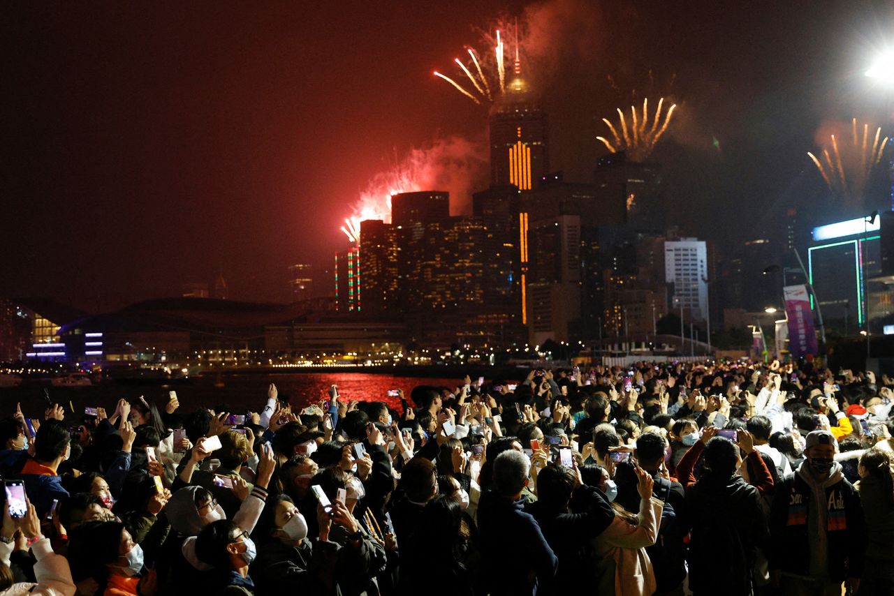 Fireworks explode over skyline building to celebrate New Year in Hong Kong, China, January 1, 2022. REUTERS/Tyrone Siu