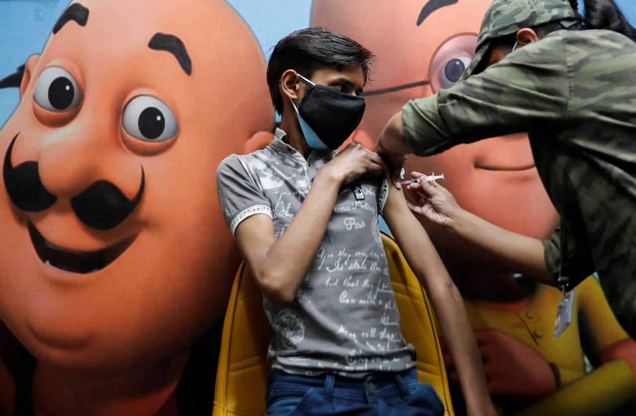 A boy receives a dose of the COVAXIN coronavirus disease (COVID-19) vaccine manufactured by Bharat Biotech, during a vaccination drive for children aged 15-18 in New Delhi, India, January 3, 2022. REUTERS/Adnan Abidi