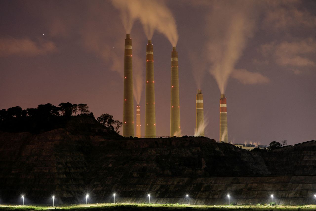 FILE PHOTO: Smoke and steam billows from the coal-fired power plant owned by Indonesia Power, next to an area for Java 9 and 10 Coal-Fired Steam Power Plant Project in Suralaya, Banten province, Indonesia, July 11, 2020. REUTERS/Willy Kurniawan