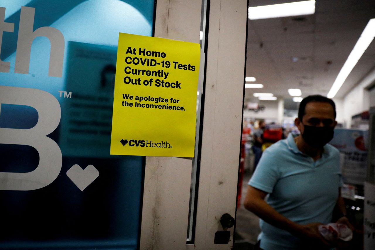 A sign informing customers that coronavirus disease (COVID-19) tests are out of stock is seen at the entrance of a CVS pharmacy as the Omicron variant of the coronavirus continues to spread through the country, in Miami, Florida, U.S. January 5, 2022. REUTERS/Marco Bello